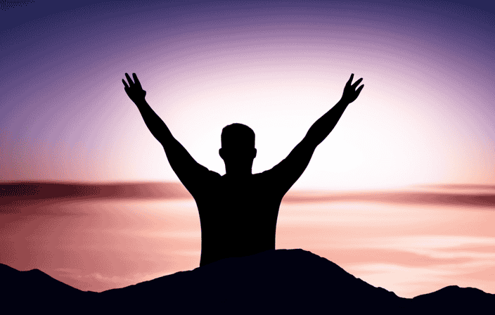 An image of a person standing confidently on top of a mountain, with arms raised in victory, as the sun sets in the background