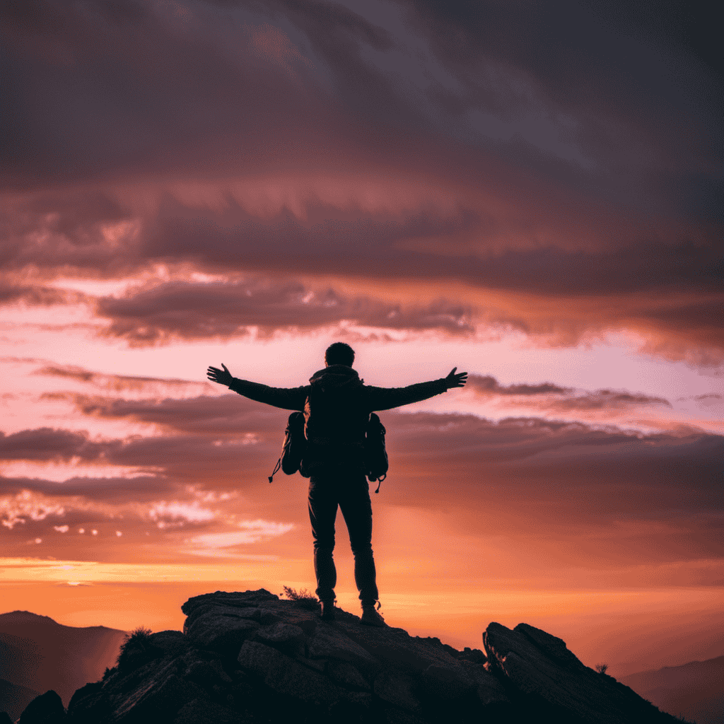 An image of a person standing on top of a mountain, arms raised triumphantly against a vibrant sunset