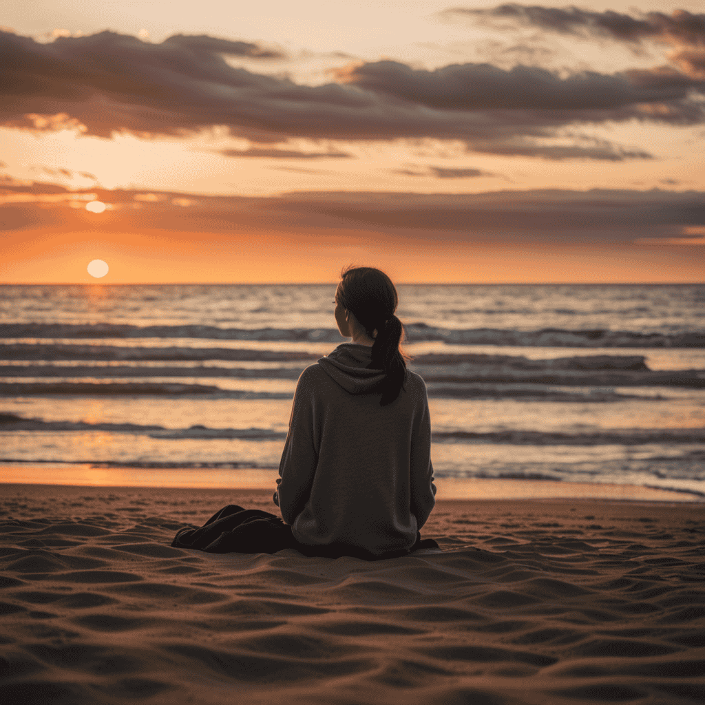 An image depicting a serene sunset scene, with a person sitting alone on a beach